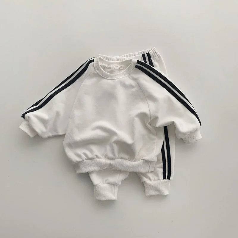 Boys and girls' spring new 2025 children's cool letter printing zipper top pants leisure sports two piece baby suit